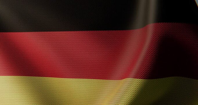 High quality 4K seamless loop of the German national flag waving in slow motion. Detailed cloth fabric texture, realistic lighting, and smooth wave motion for European news, sports, and politics.