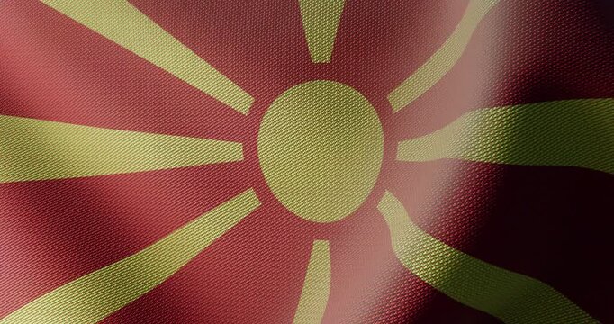 High quality 4K seamless loop of the North Macedonian national flag waving in slow motion. Detailed cloth fabric texture, yellow sun, and smooth wave motion for culture, news, and national events.