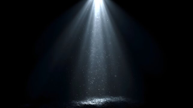 A single spotlight beam illuminates floating dust particles against a dark background  creating an elegant minimalist scene