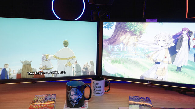 POV reading Japanese manga comic Frieren with PC monitors with neon lights in background
