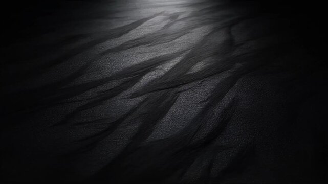 Dark graphite texture shimmering under soft top light background animation