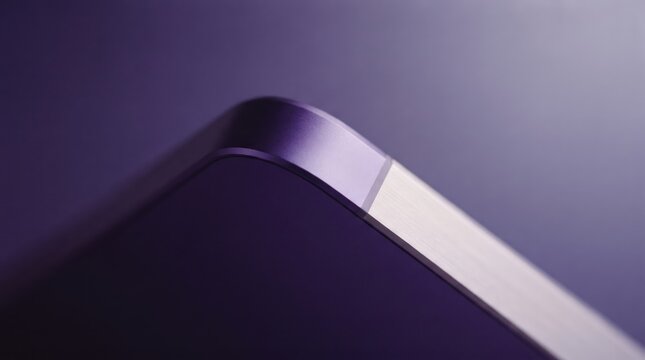 Minimal close-up of smartphone edge on purple background