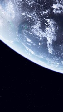 Earth taken from space with clouds covering the blue surface. Stars are visible in the dark background. The scene captures the planets atmosphere and geography.