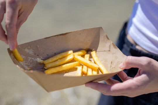 Sharing French Fries Outdoor Together