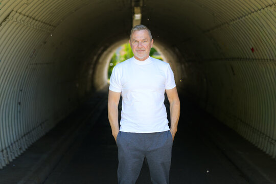 Mature Man Standing Urban Tunnel