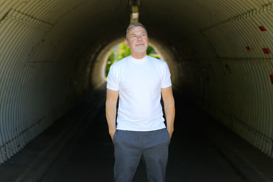 Confident Mature Man Standing Thoughtfully