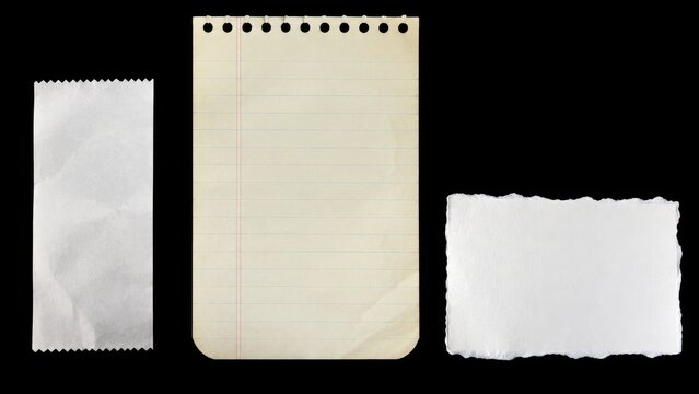 Three blank paper pieces isolated on black background
