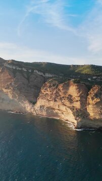 Steep limestone cliffs drop into the Mediterranean Sea along Route des Cretes. Scenic coastal view offshore Cassis, France