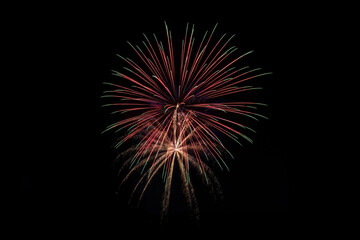 Fototapeta premium fireworks with dark sky background. green, red, and white. independence day celebration, santa clarita, california.
