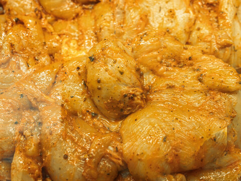 Marinated Chicken Thighs Ready for Sale in Grocery Store