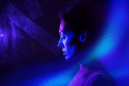 Neon cyberspace portrait of woman with AI assistant