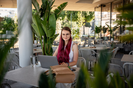 Serene freelancer working at a stylish outdoor cafe