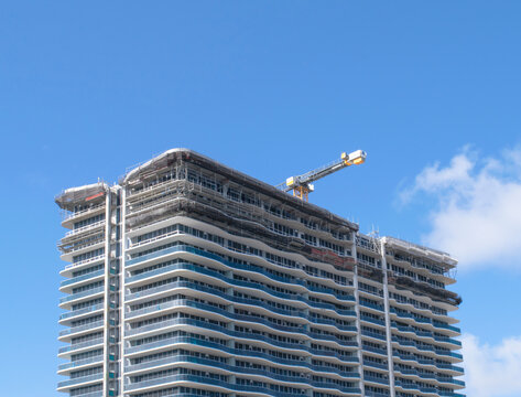 blue sky, apartments buildings construcction in progress, crane in Pompano beach Miami, FL, USA