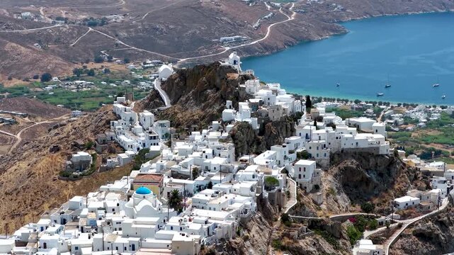 Panoramic aerial view of the main town Chora on Serifos island, Cyclades, Greece, high up on a mountain with whitewashed houses against the blue sea