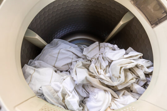 Laundry inside front load washing machine drum closeup