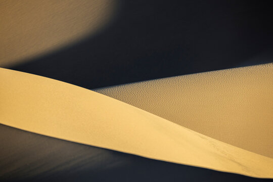 Abstract Death Valley sand dune curves with light and shadow