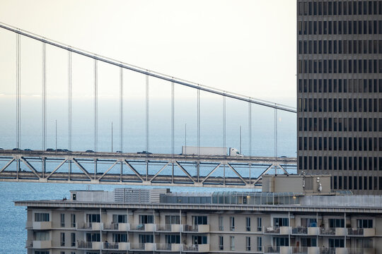 Golden Gate Bridge detail behind apartment building, San Francisco