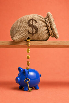 Money bag drops gold coins into a blue piggy bank below