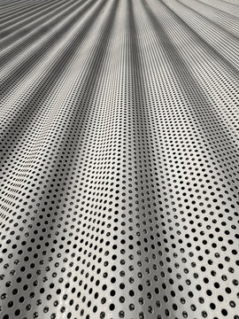 Abstract perforated metal surface with flowing optical pattern