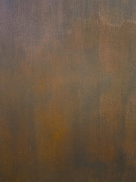 Abstract brown textured surface with muted vertical tones