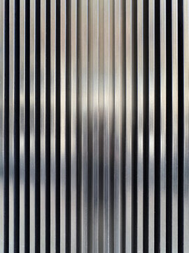 Abstract vertical metallic stripe texture background in silver
