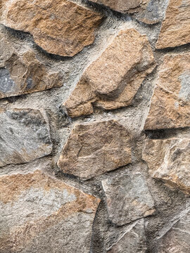Rough natural stone wall texture with gray mortar detail