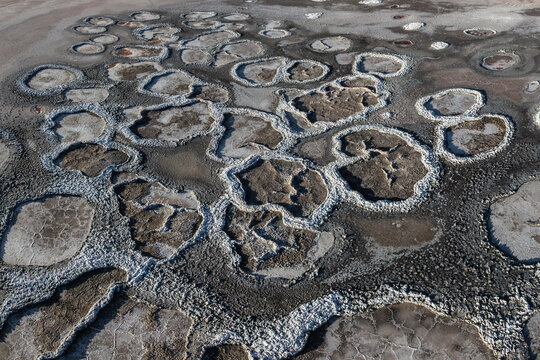 Arid salt flats texture with mineral pools at Laguna Espejo