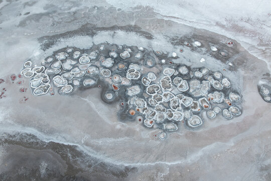 Aerial abstract salt patterns on Laguna Espejo shoreline