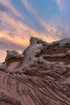 Sandstone layers at White Pocket under twilight sky