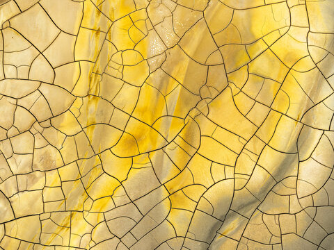 Aerial view of colorful cracked earth patterns
