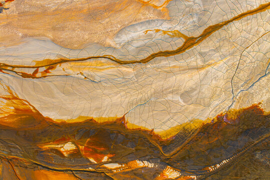 Aerial view of colorful cracked mineral texture