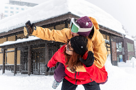 Friends enjoying winter fun at a snowy ski resort