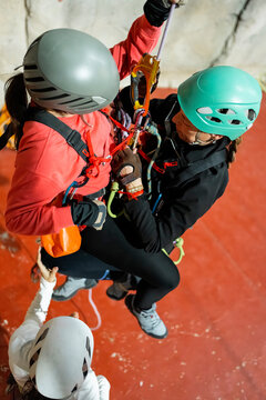 Women practice vertical rescue techniques during indoor training