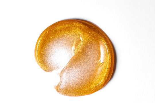 Gold cosmetic smear with shimmering luxury texture
