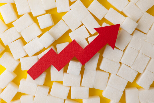 Sugar and an arrow going up. Blood sugar level. Diabetes concept.