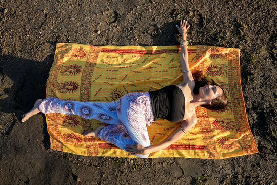 Woman practicing outdoor yoga for relaxation and balance