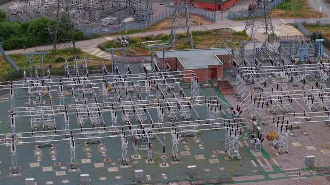 Close-Up Aerial View of High Voltage Substation Components and Transformers