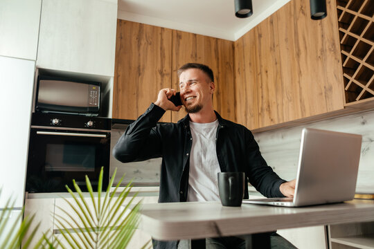 Man working remotely with laptop at home