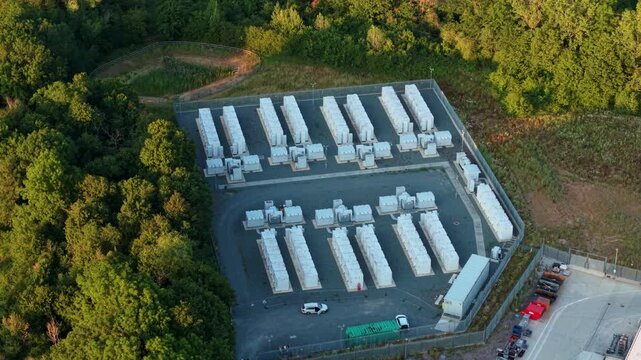 Close up aerial view of Battery Energy storage Systems BESS lithium ion cells at large electrical substation in Enderby, UK.