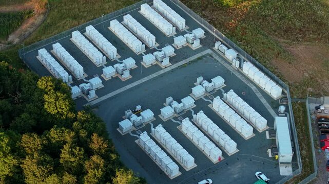 Close up aerial view of Battery Energy storage Systems BESS lithium ion cells at large electrical substation in Enderby, UK.