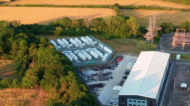Close up aerial view of Battery Energy storage Systems BESS lithium ion cells at large electrical substation in Enderby, UK.