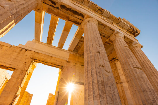 Ancient Greek architecture with sunlit columns