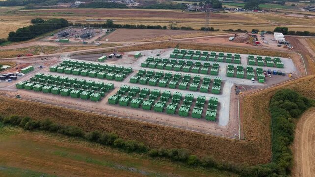 Aerial view of containerised lithium iron phosphate BESS energy storage units at UK utility site