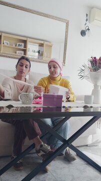Daughter supporting mother with cancer preparing gifts together