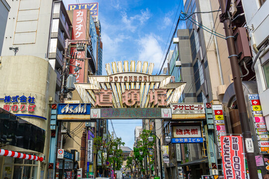Famous Dotonbori street sign marks the entrance to the premier entertainment hub of Osaka