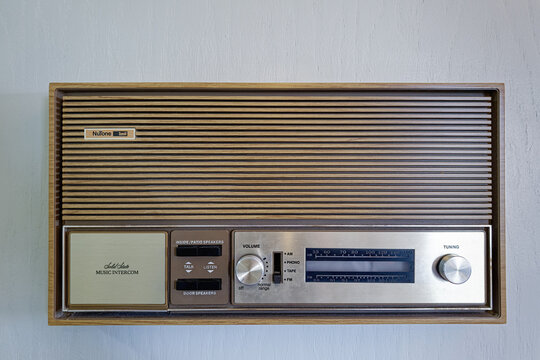 June 28, 2026 - Vernal, Utah, USA: The faceplate of a vintage NuTone music intercom with a radio tuner