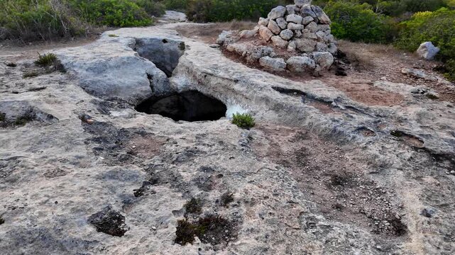 Xemxija, Malta 29.07.2026 - Xemxija Heritage trail, Neolithic tombs dug into the coralline limestone.
