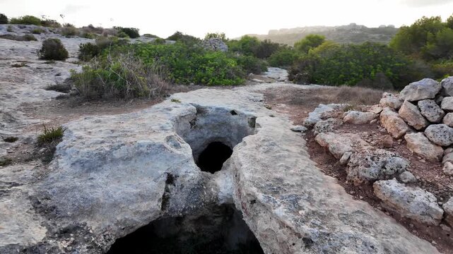 Xemxija, Malta 29.07.2026 - Xemxija Heritage trail, Neolithic tombs dug into the coralline limestone.