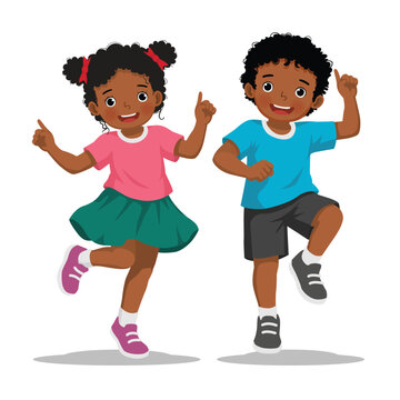 Two African children dancing jumping together
