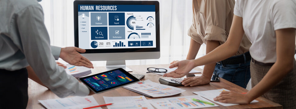 Human resources management software on computer screen helping human resources employee to manage recruitment, payroll, staff searching and KPI evaluation brisk